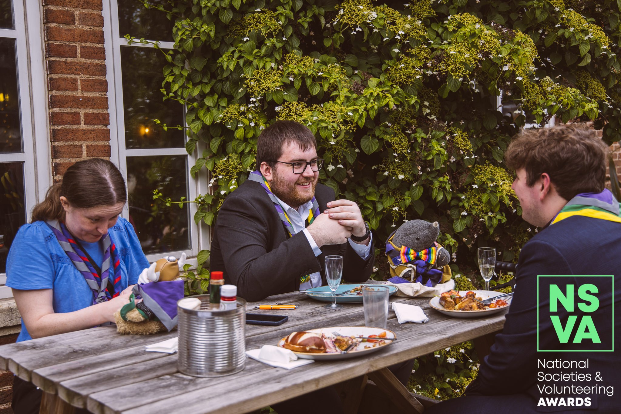 Members of the Viking Rally committee sat outside at a picnic table at the drinks reception / BBQ before the awards